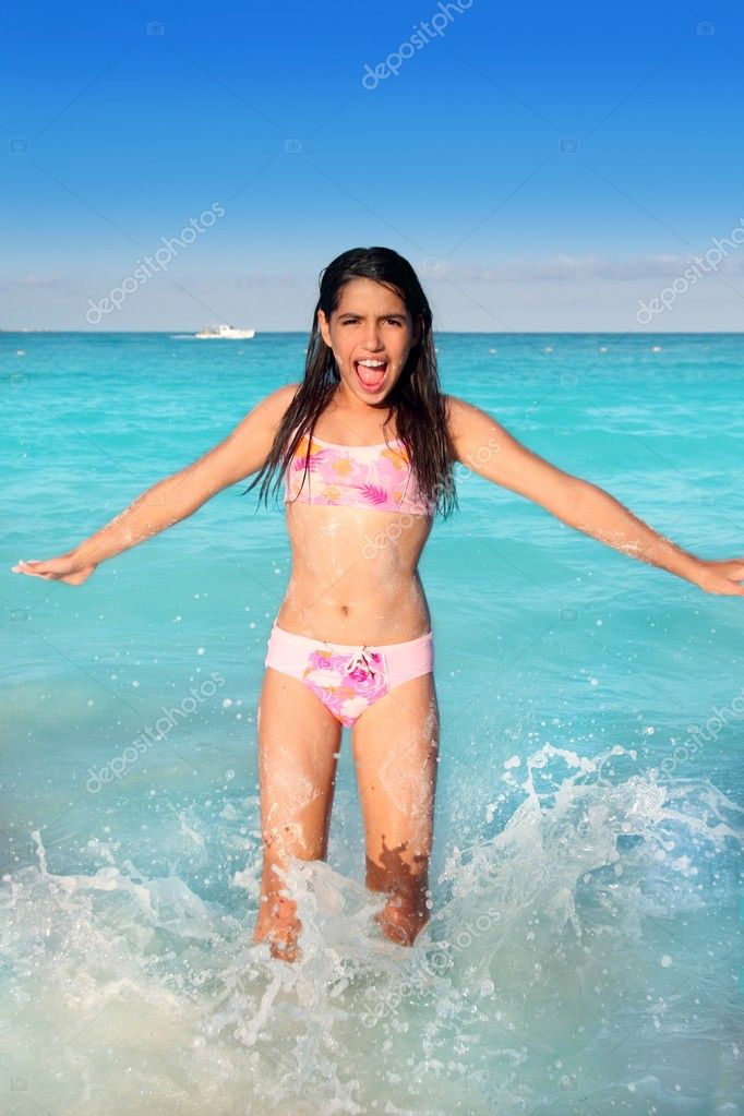 depositphotos_5125460-Latin-teen-girl-jumping-on-Caribbean-beach-shore.jpg