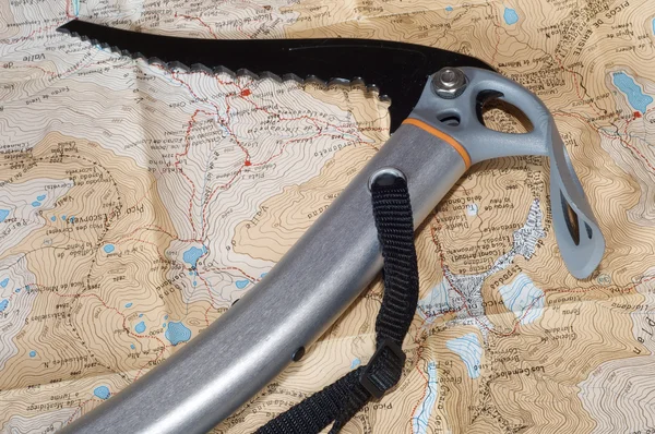 Climbing ice ax and topographic map