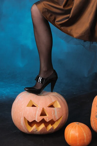 Leg on pumpkin — Stock Photo, Image