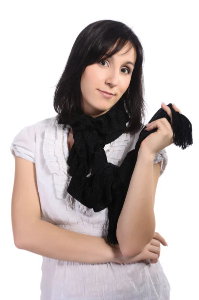 Meisje in een witte blouse met een zwarte sjaal, geïsoleerd — Stockfoto