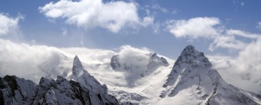 Panorama Mountains in cloud. Caucasus, Dombay. clipart