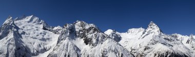 Panorama Caucasus Mountains. Dombay. View from the ski slope clipart