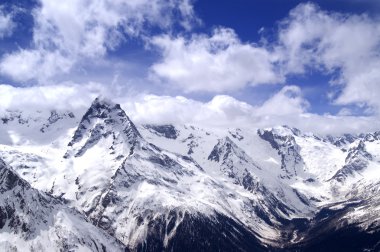 Caucasus Mountains in cloud. Dombay. clipart