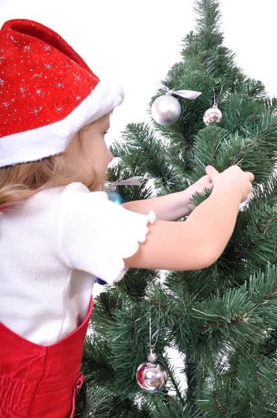Kislány közel karácsonyfa — Stock Fotó