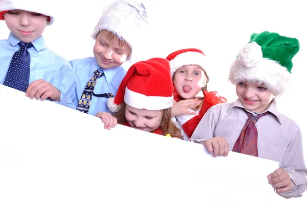 Kerstmis kinderen met een spandoek — Stockfoto