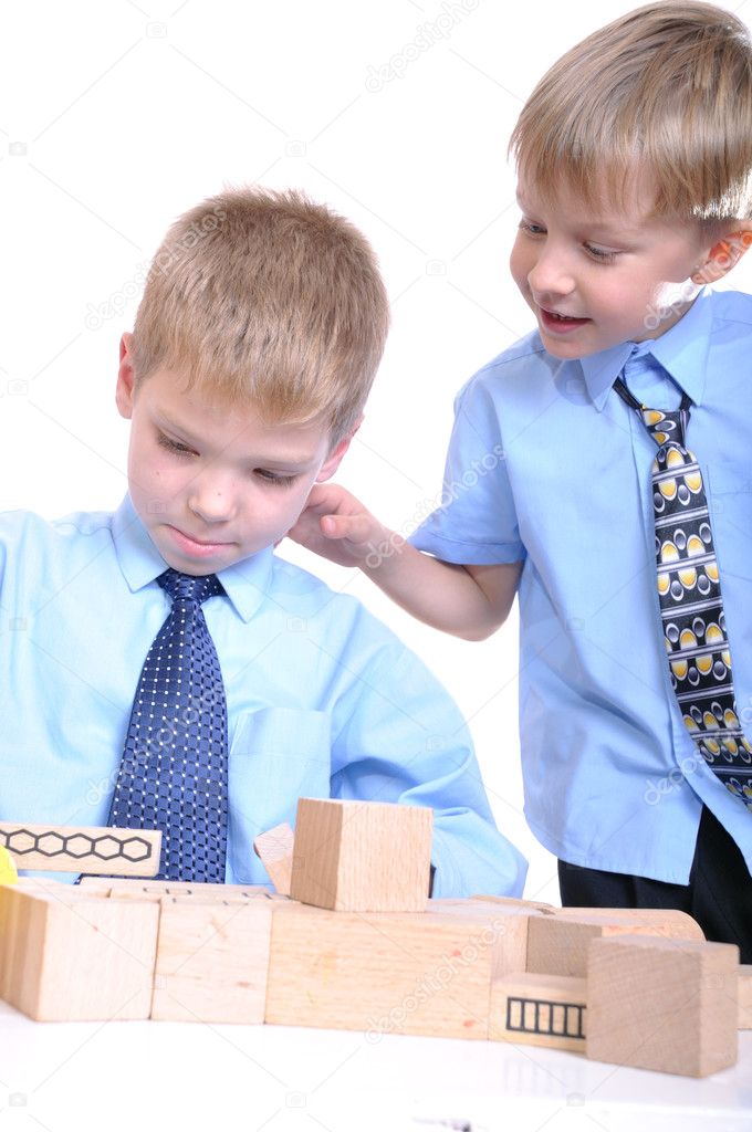Boys playing with bricks