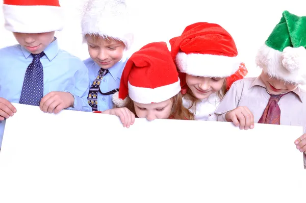 Christmas children with a banner — Stock Photo, Image
