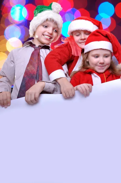 Karácsonyi gyerekek egy banner — Stock Fotó