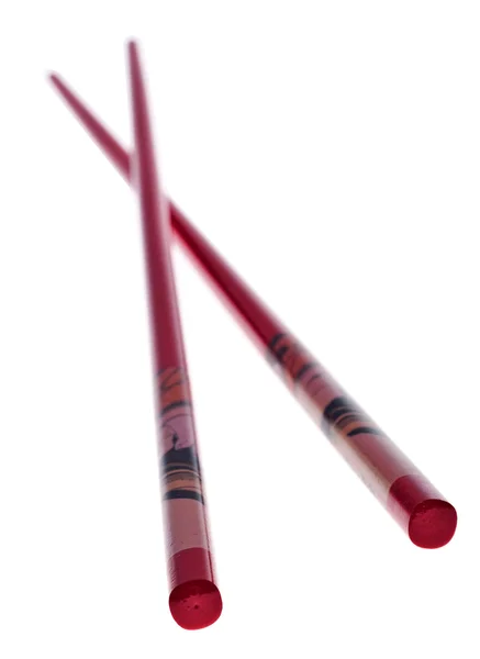 Красные китайские палочки на белом — стоковое фото