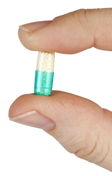 One pill on the white backgrouds — Stock Photo, Image