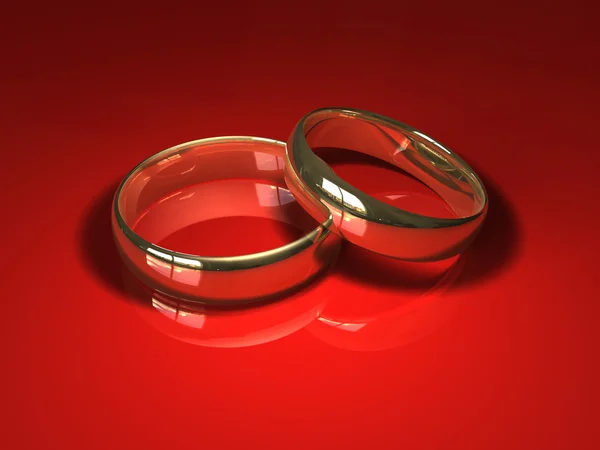 Wedding rings on red — Stock Photo, Image