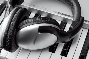 Headphones on synthesizer keyboard clipart