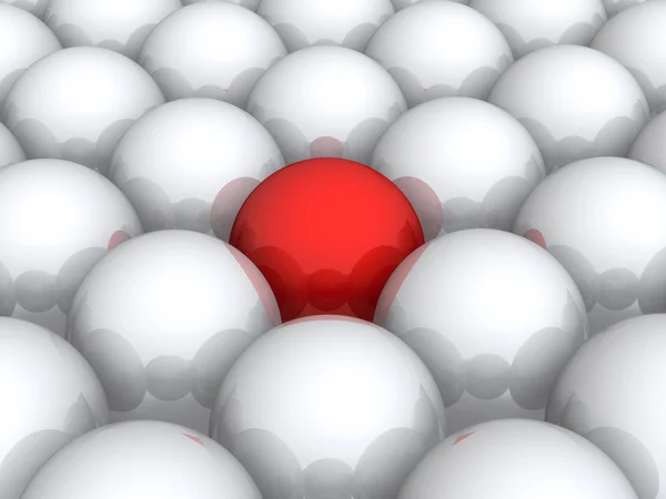 Κόκκινη μπάλα μέσα σε αυτά που λευκό — Φωτογραφία Αρχείου