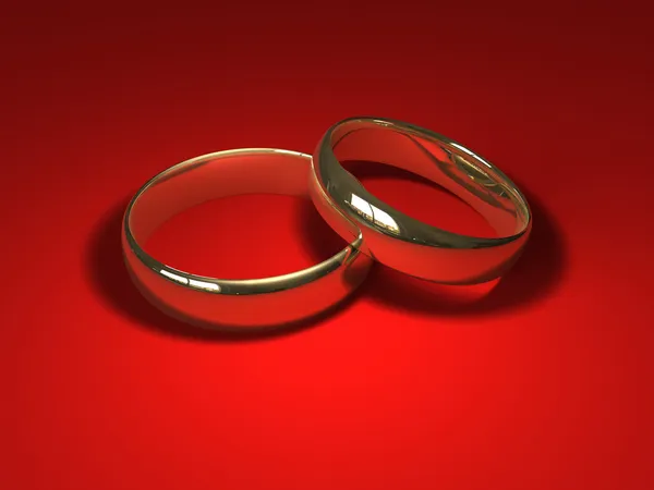 在红色上的结婚戒指 — 图库照片