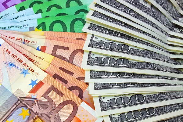 Bündel Dollar und Euro — Stockfoto