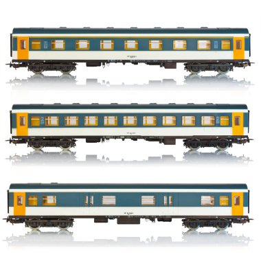 Set of miniature passenger railroad cars clipart