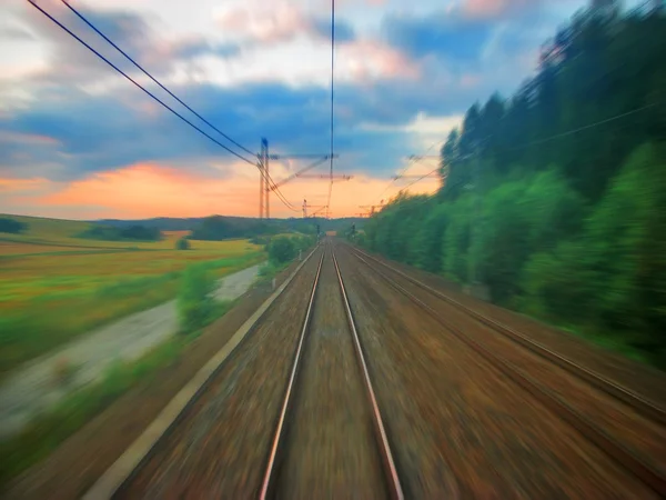 Escénica puesta de sol del ferrocarril con desenfoque de movimiento —  Fotos de Stock