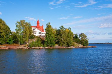 Cottage on island in Scandinavia clipart