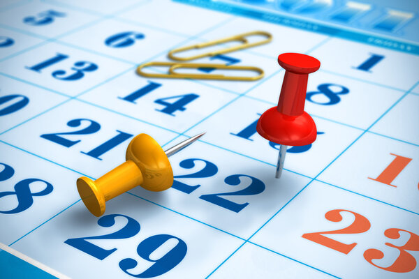 Pushpins and calendar