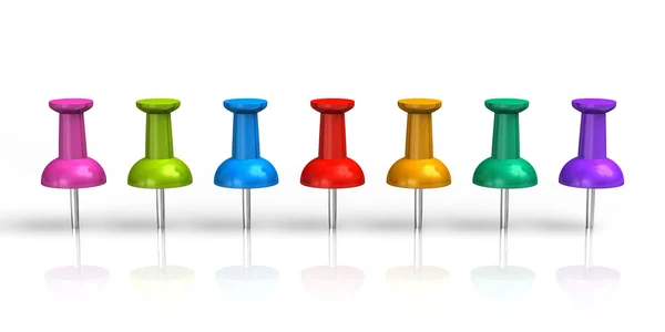 Row of color pushpins — Stock Photo, Image