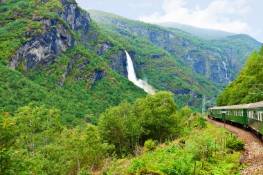 By the train across Scandinavian mountains clipart