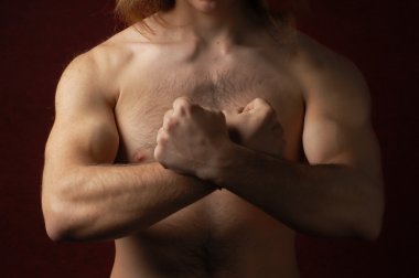 Muscular male torso with crossed arms in a sign of 'X' clipart