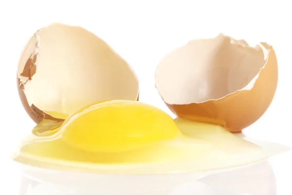 Cracked Brown Egg Yolk Spilling White Background — Stock Photo, Image
