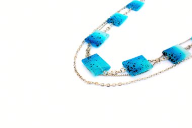 Blue necklace isolated on white background. clipart