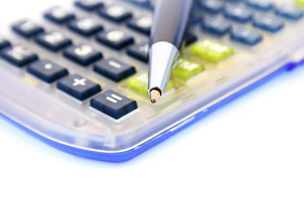Kalkulator og penn – stockfoto