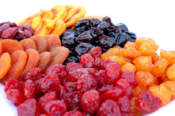 stock image Dried fruits in plate isolated on white background.