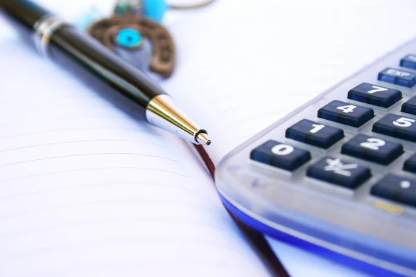 Calculator, pen and notebook — Stock Photo, Image