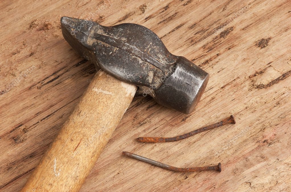 Old hammer and a rusty nail — Stock Photo © Observer #5293225