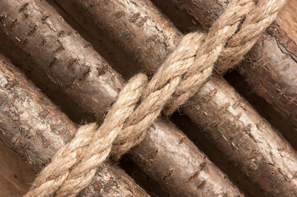 Wooden fence with rope — Stock Photo © Observer #5339670