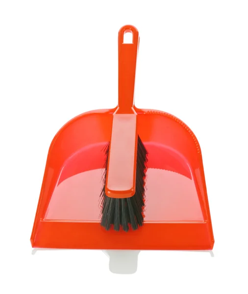 Red dustpan with brush on it — Stock Photo, Image