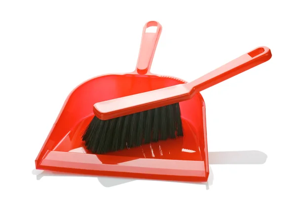 Escova vermelha em dustpan isolado — Fotografia de Stock