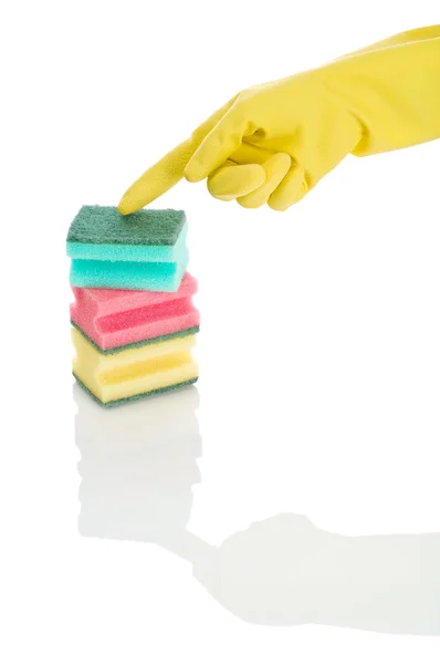 Ręka z kolorowe gąbki — Zdjęcie stockowe