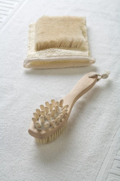Massager and bast on towel — Stock Photo, Image