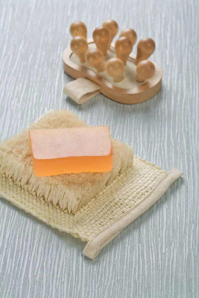 Massager and soap on bast — Stock Photo, Image