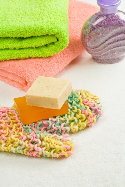 Soap on bast and towels with salt — Stock Photo, Image