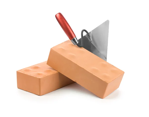 Trowel on bricks isolated Stock Picture