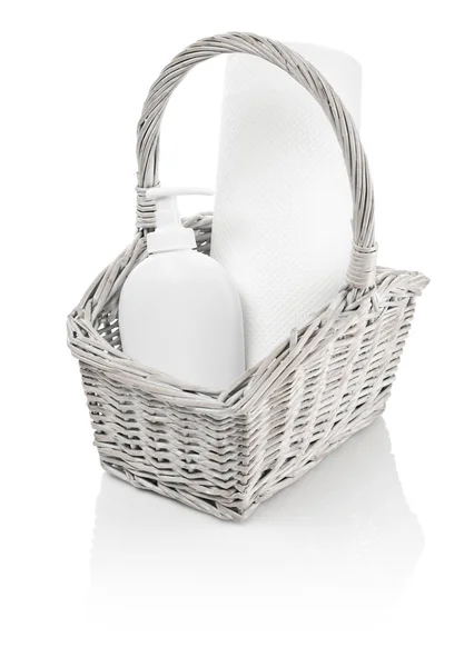 Basket with bottle and paper towel — Stock Photo, Image