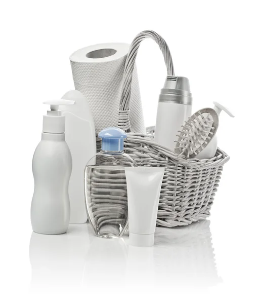 Basket with cosmetics, paper towel and hairbrush — Zdjęcie stockowe