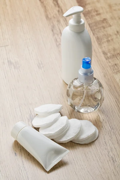 Bottles tube and cotton pads — Stock Photo, Image