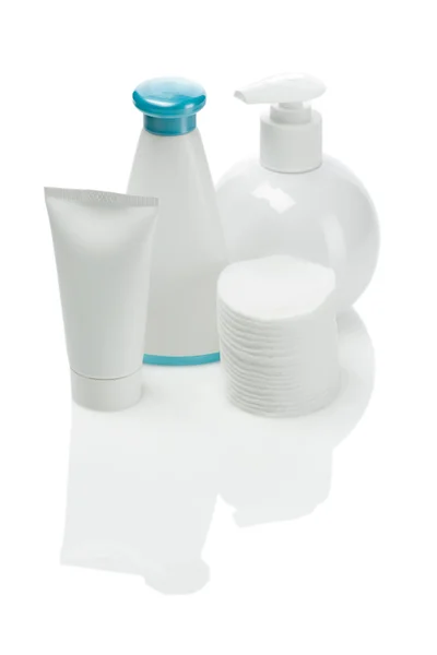 Bottles tube and cotton pads — Stock Photo, Image
