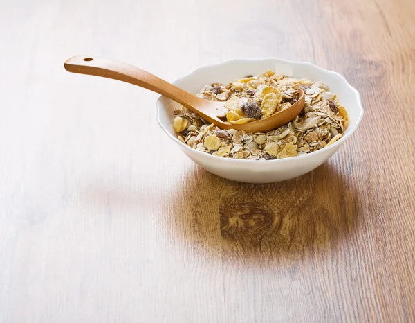 Bowl with muesli an spoon — Stock Photo, Image