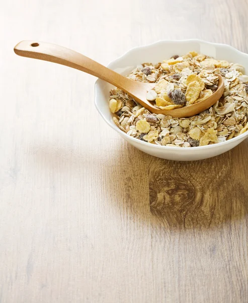 Bowl with muesli on wooden background — Stock Photo, Image