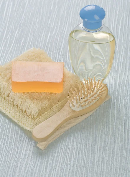 Bottle hairbrush soap and bast — Stock Photo, Image