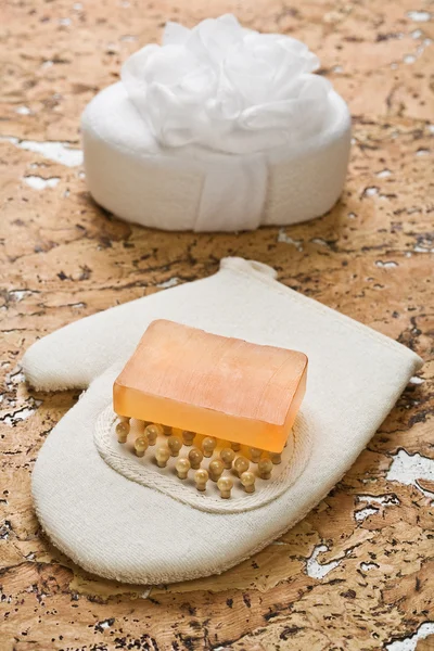 Bath sponge and soap on cork wood — Stock Photo, Image