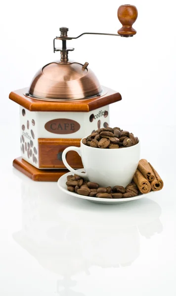 Coffe mill and cup with beans — Stock Photo, Image