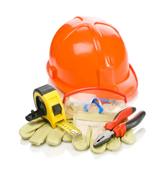 Herramientas de construcción sobre guantes — Foto de Stock